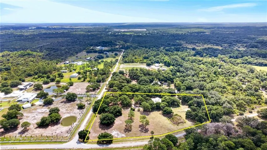 Expansive parcel featuring a mix of mature trees and open clearings
