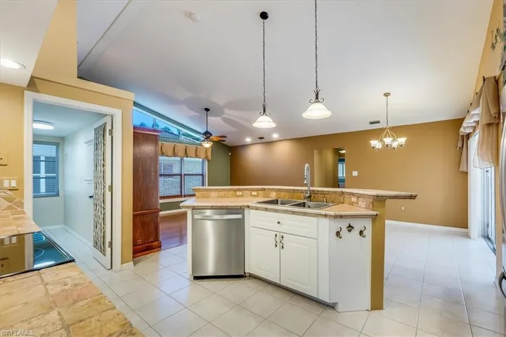 Kitchen Island and view of laundry room entry (Before Paint)