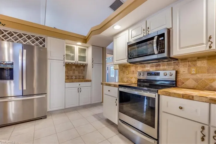 Kitchen with new stainless steel appliances (Before Paint)