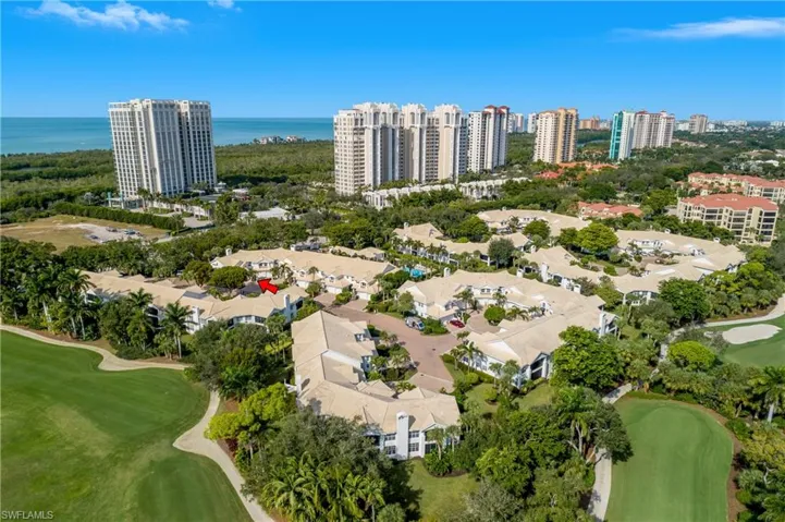 Walk Across Pelican Bay Blvd to access the walkway to the tram station to the beach.