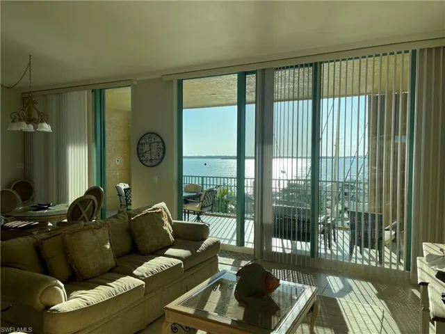 Living area with a water view and expansive windows
