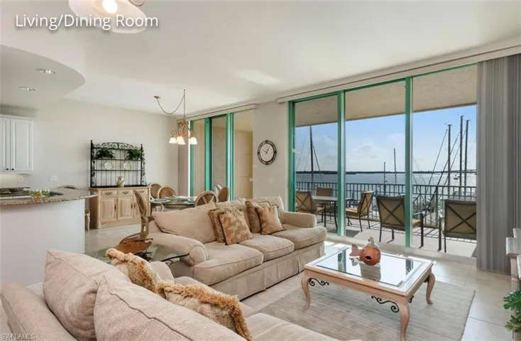 Living area with light and wall of impact windows