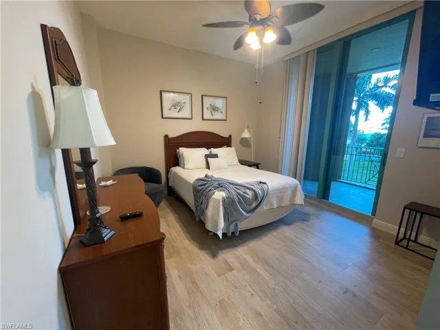 Bedroom featuring light wood-style flooring, access to outside, and ceiling fan