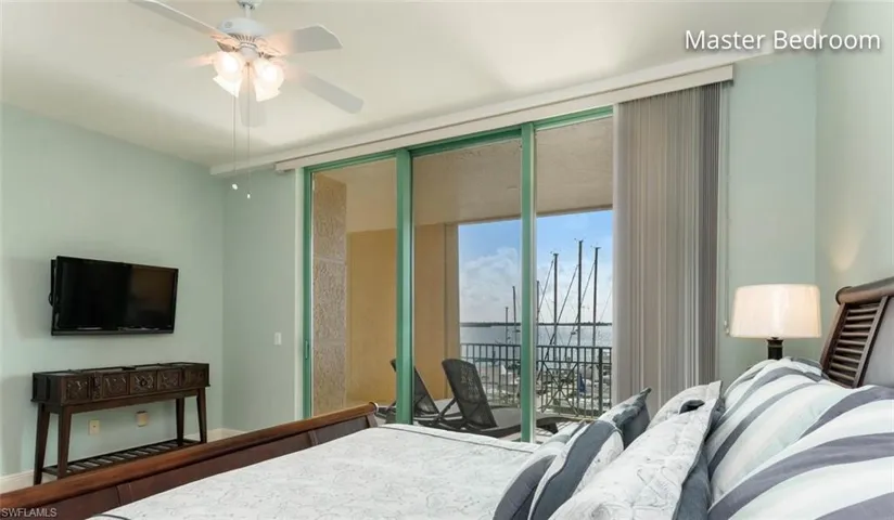 Bedroom featuring access to exterior and expansive windows