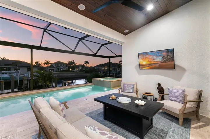 View of swimming pool with a pool with connected hot tub