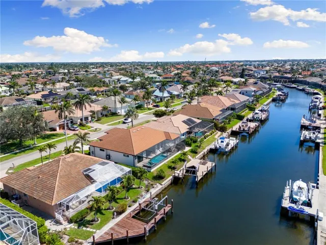 Drone / aerial view with a residential view and a water view