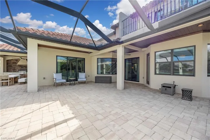 Patio / terrace featuring a lanai, a patio area, and grilling area
