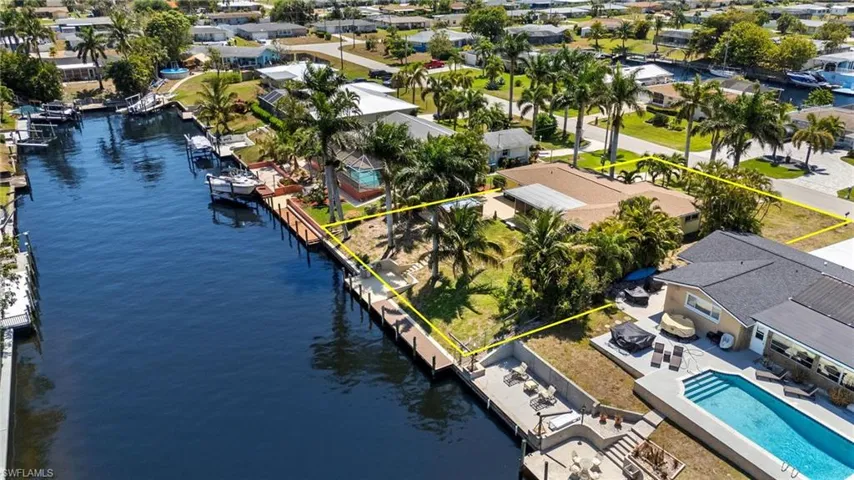 Aerial view featuring a residential view and a water view