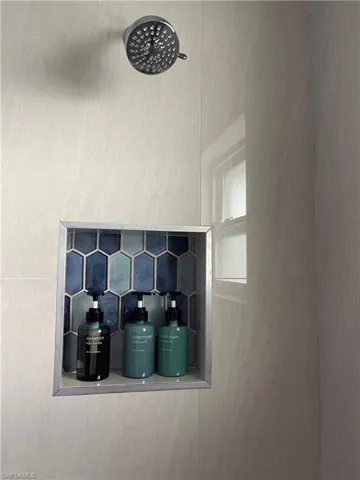 Bathroom view of a tile shower