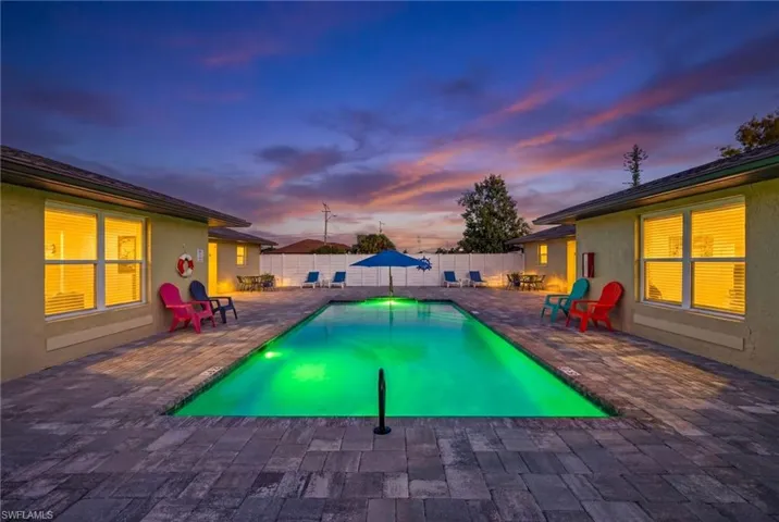 View of swimming pool with a fenced backyard and a patio