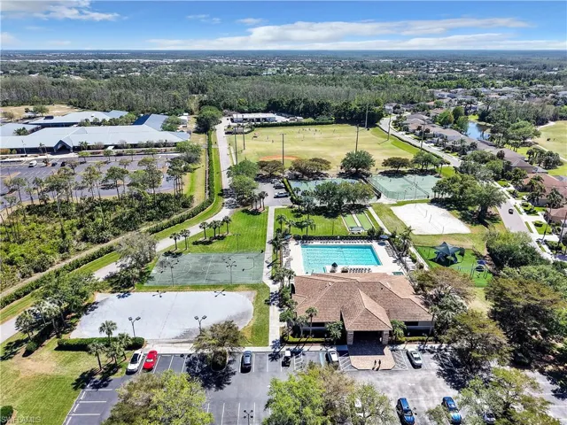 Community amenities featuring a swimming pool, multiple tennis courts, a sand volleyball court, and a clubhouse