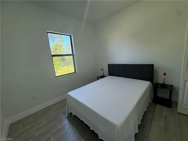 Bedroom with baseboards
