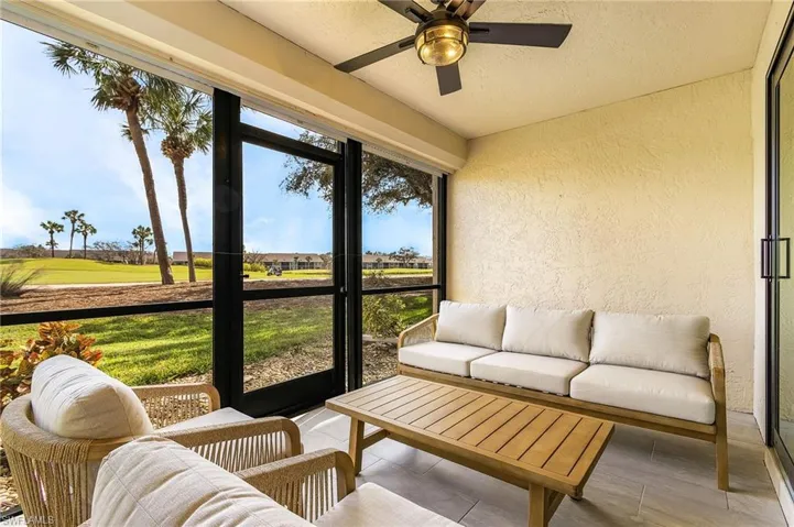 Sunroom featuring ceiling fan