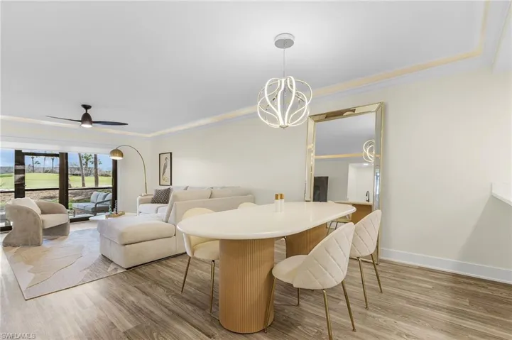 Dining are with chandelier and LVT