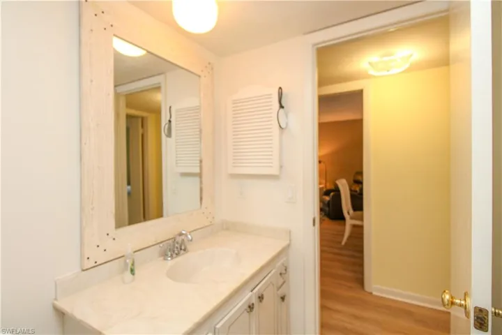 Bathroom featuring vanity and hardwood / wood-style floors