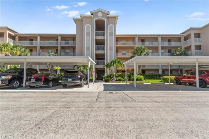 Multi-story condominium building featuring private balconies with white railings