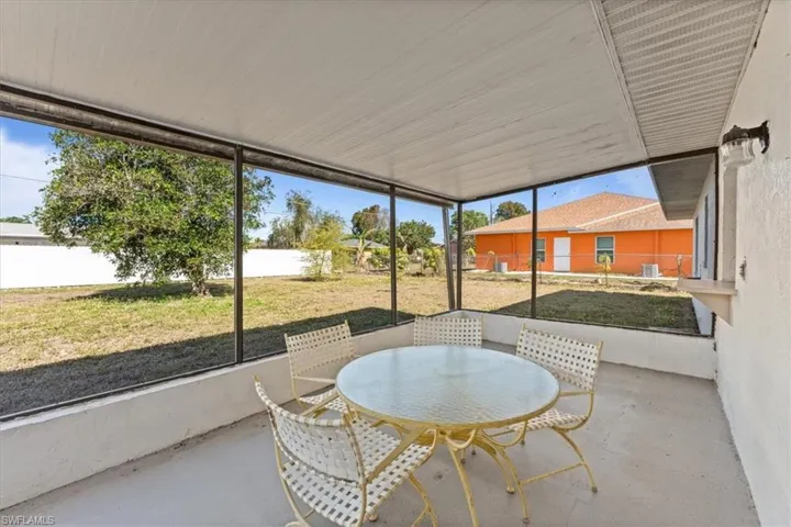 Sunroom / solarium featuring outdoor dining space
