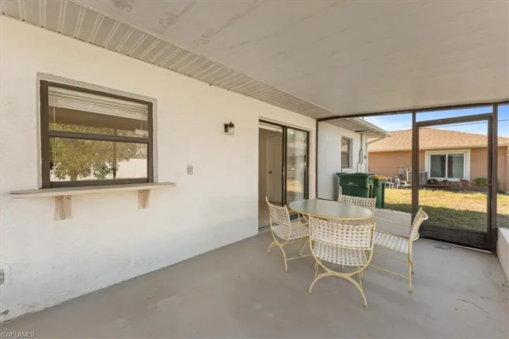 Sunroom featuring outdoor dining space and plenty of natural light