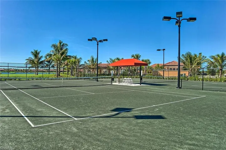 View of tennis court featuring community basketball court