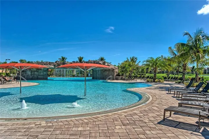 Community pool featuring a patio