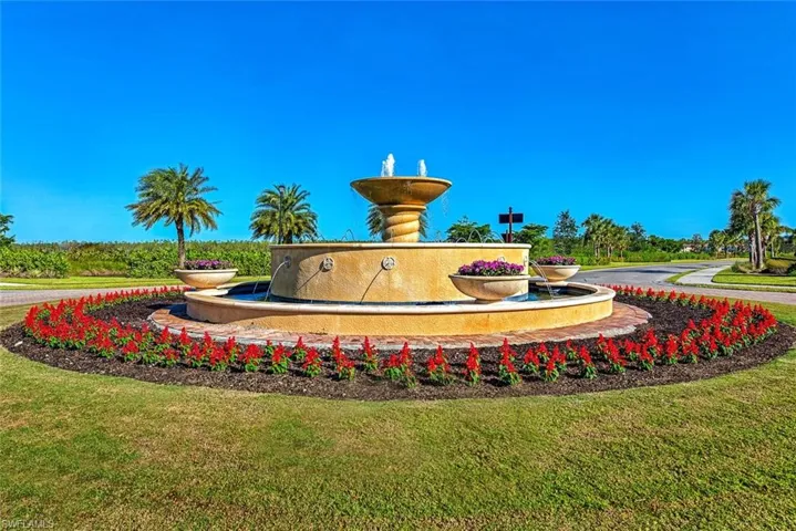 View of home's community with a yard