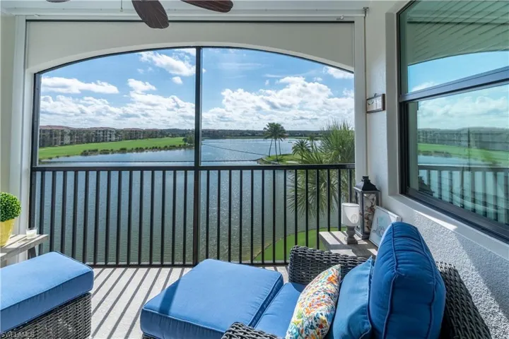 Sunroom / solarium with a water view and healthy amount of natural light