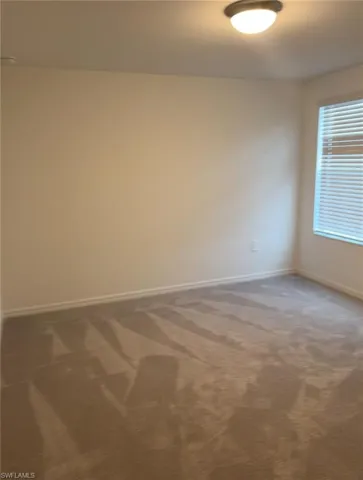 upstairs bedroom featuring carpet floors