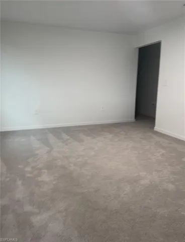 Upstairs bedroom with carpet flooring