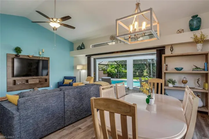Sliders open to include the outdoor space with the best open concept to the pool!