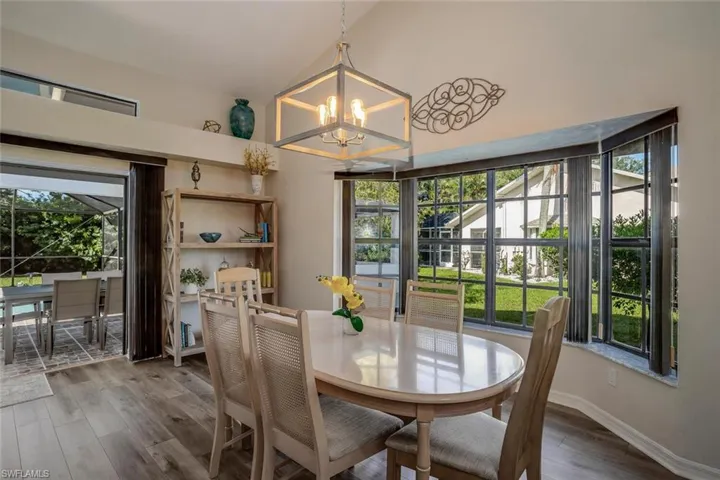 Dining room with plenty of light and for the evenings romantic chandelier lighting.