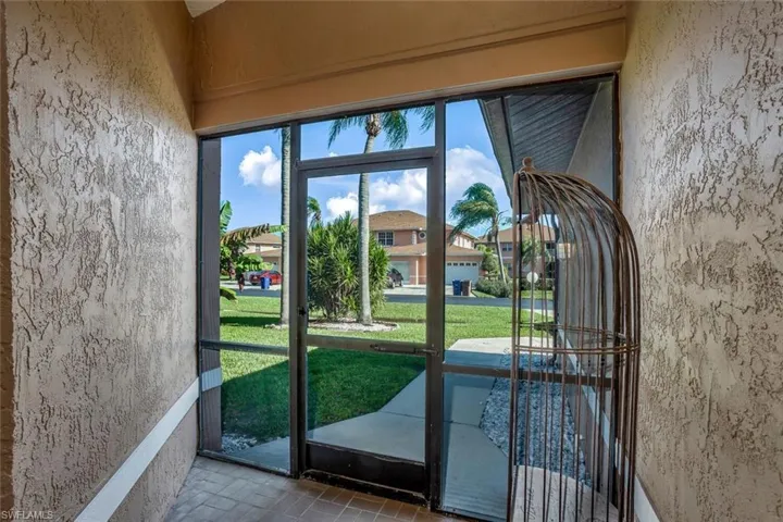 Screened in front lanai for flow of air in bright spring days and no bugs!