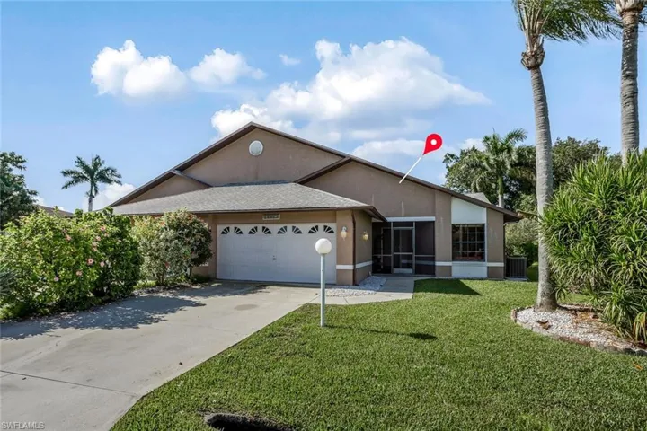 Plenty of parking with 2 car garage and beautiful landscaping pie shaped lot.