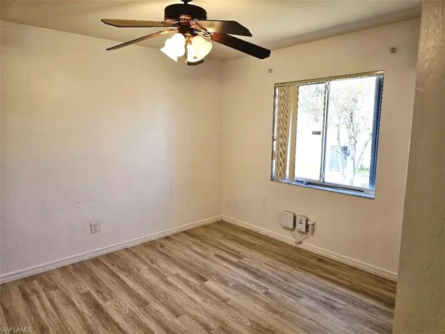 Spare room featuring light wood finished floors and a ceiling fan