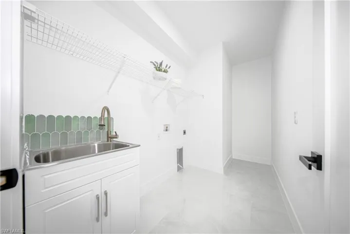 Spare room featuring a raised ceiling, recessed lighting, and a ceiling fan