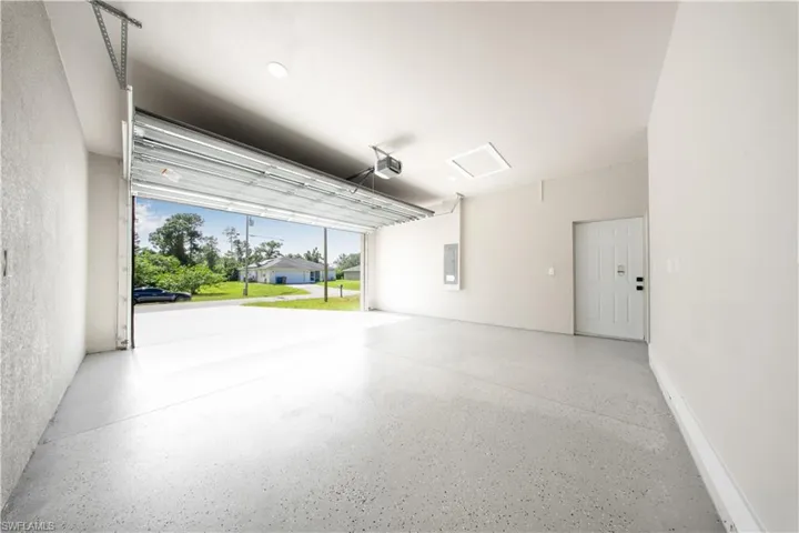 Empty room with recessed lighting, a ceiling fan, and a raised ceiling
