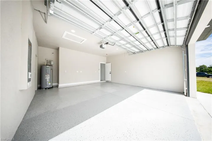 Back of property featuring a patio, stucco siding, and ceiling fan