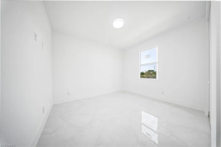 Bathroom featuring vanity, a stall shower, and tile patterned floors
