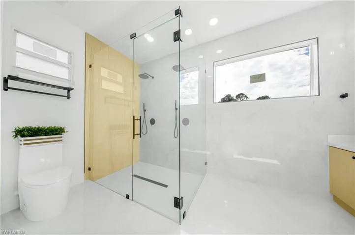 Full bath featuring double vanity