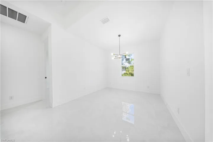 Unfurnished room featuring baseboards