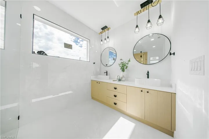 Empty room featuring ceiling fan, recessed lighting, and a raised ceiling