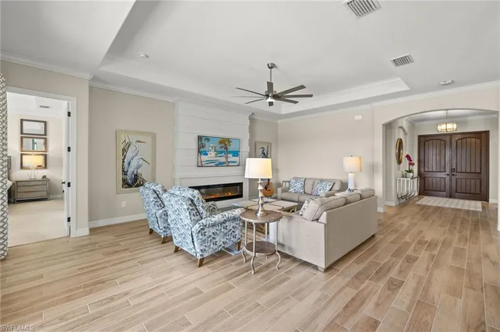 Great Room with Electric Fireplace and Custom Paneling