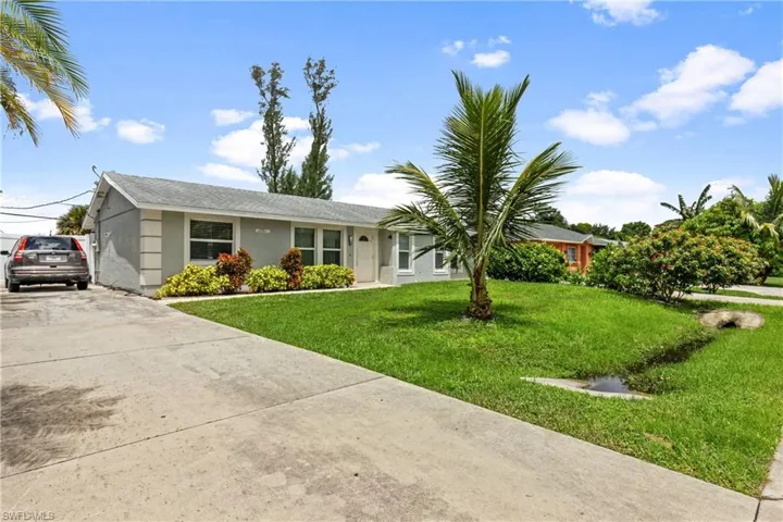 Single story home featuring a front yard