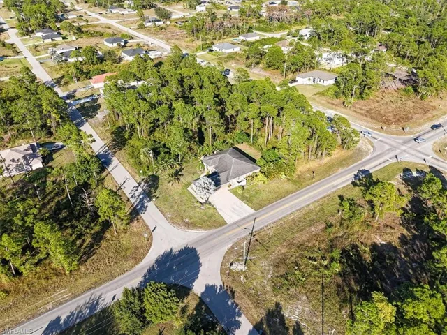 View of property location with nearby suburban area