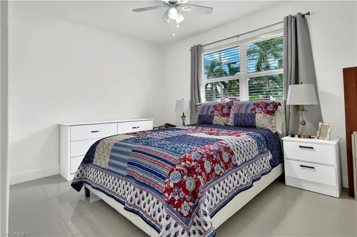 Bedroom featuring ceiling fan and light tile patterned floors