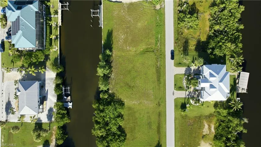 Expansive lot featuring direct canal frontage and street access
