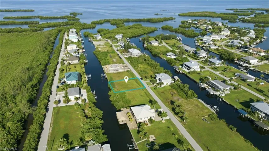 Waterfront lot with canal access and proximity to open water