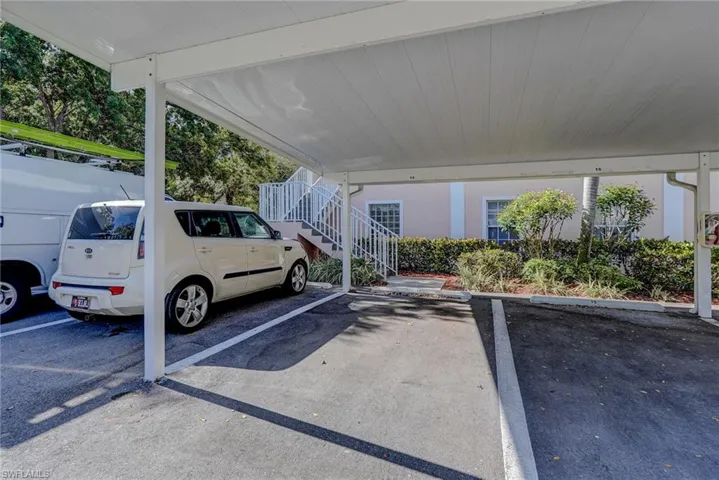 Covered parking lot featuring stairway