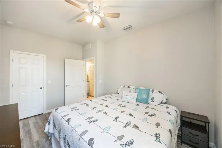Bedroom featuring light wood-style floors and baseboards
