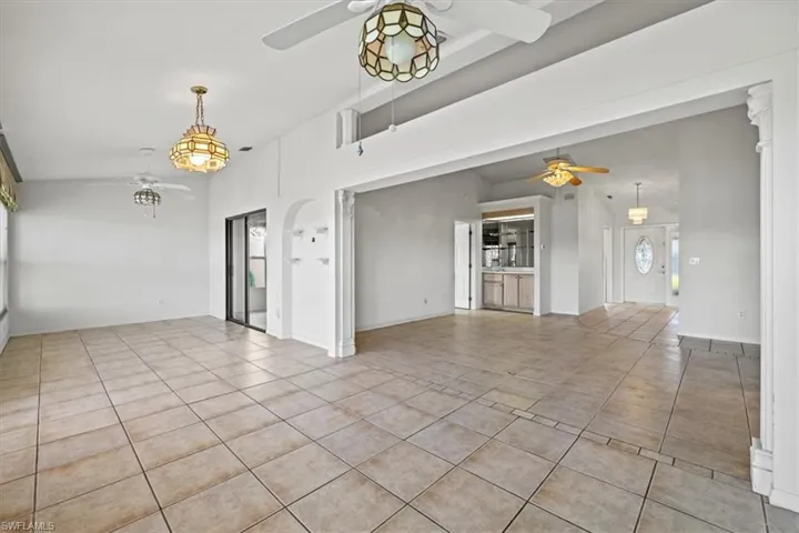 Spare room featuring light tile patterned flooring and ceiling fan