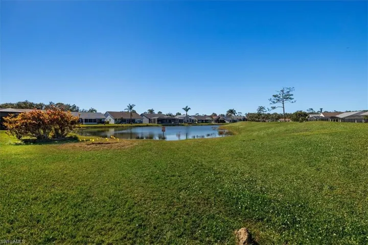 View of yard with a water view